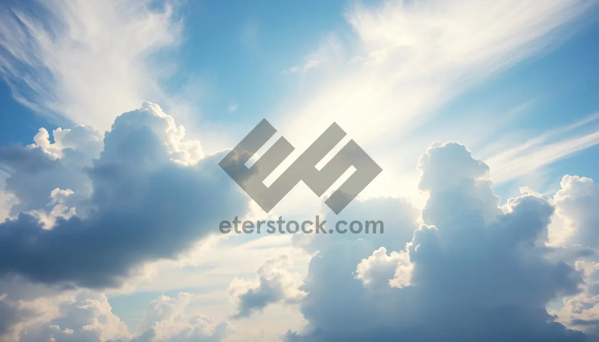 Picture of Summer sky with fluffy clouds and bright sun.