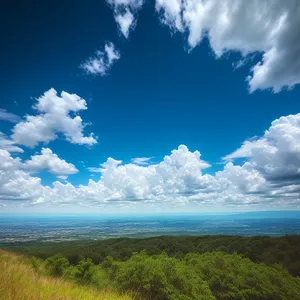 Serene Summer Sky Over Majestic Mountains