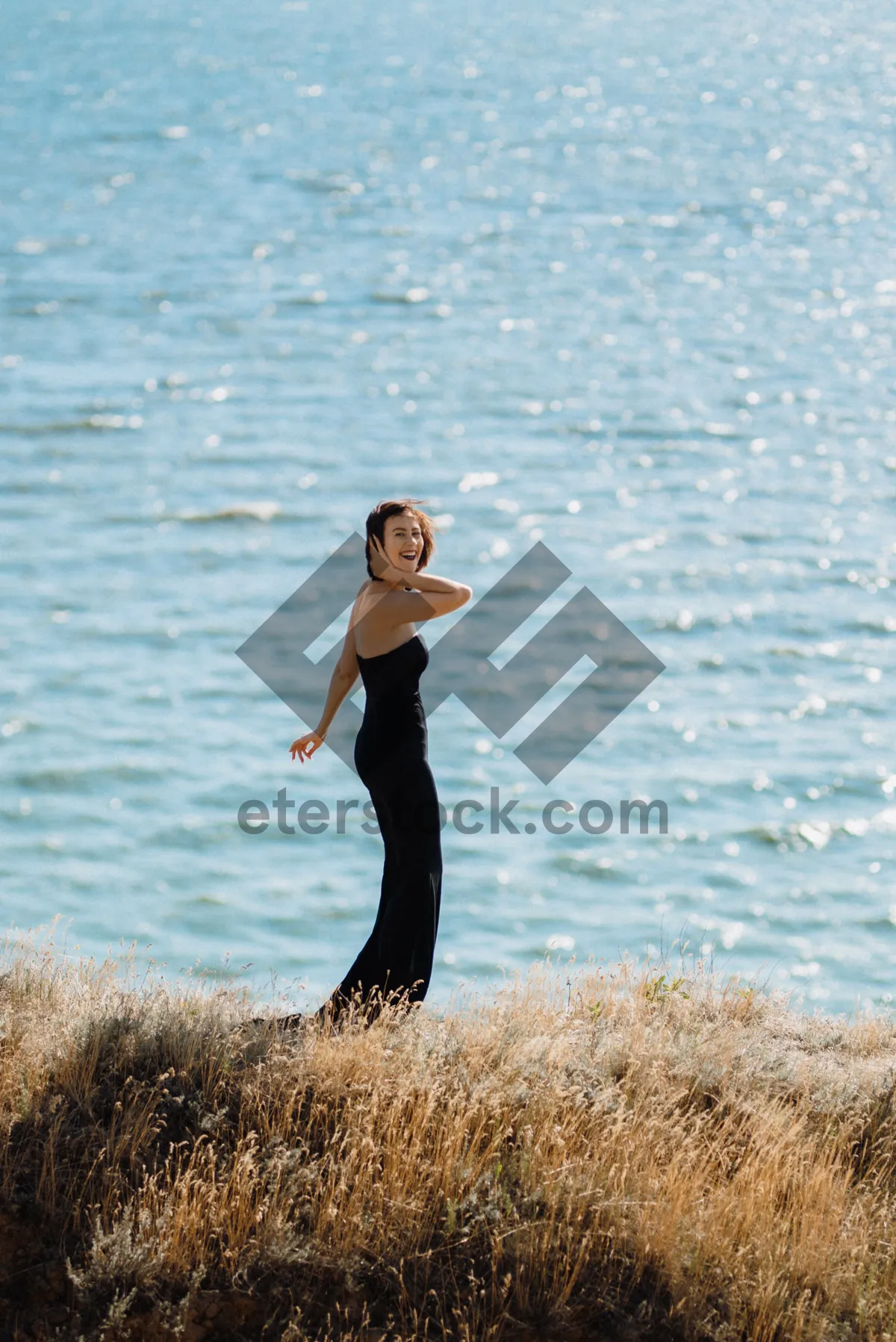 Picture of Happy man in swimsuit enjoying sunny beach day.