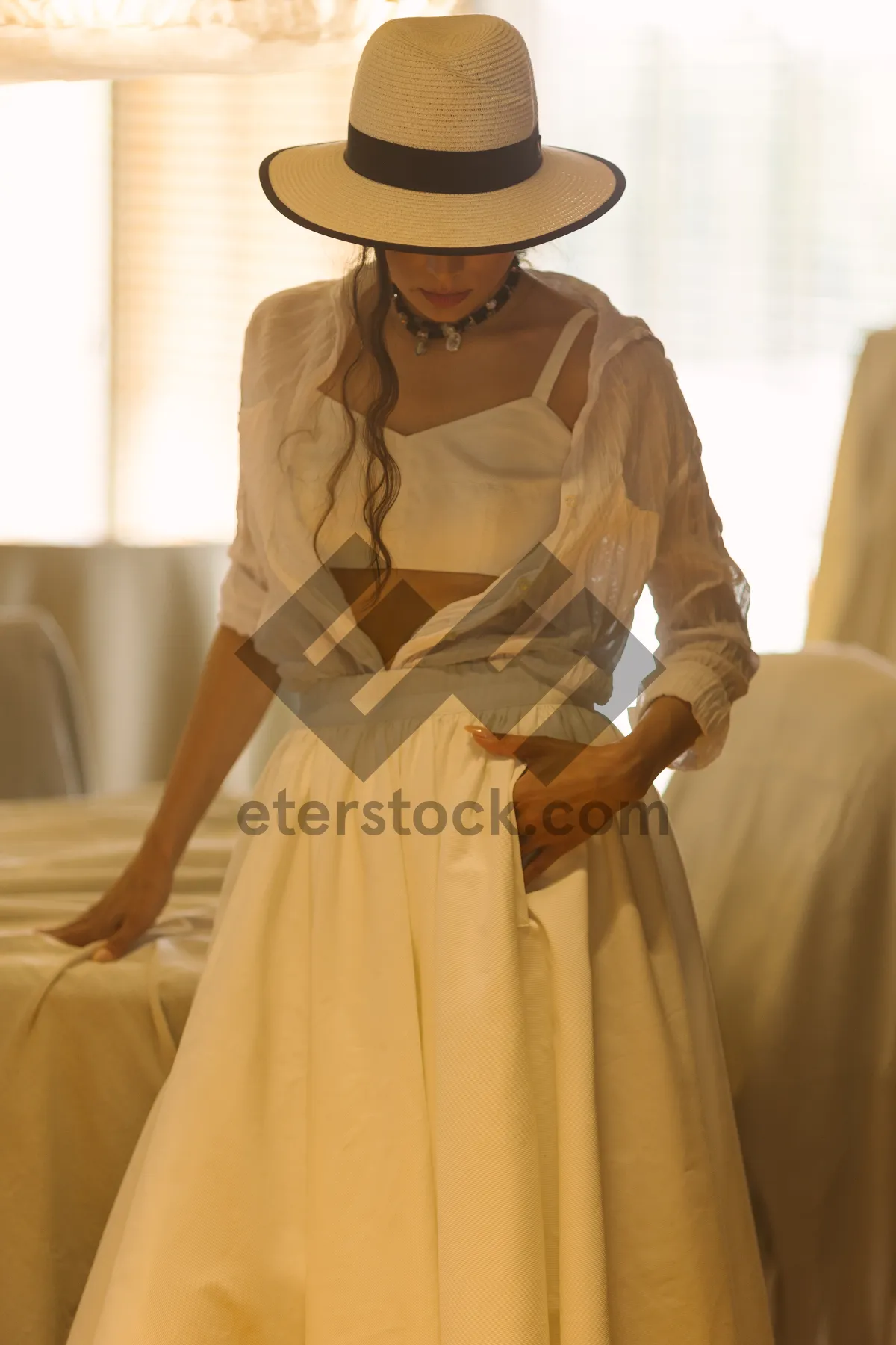 Picture of Happy Bride in Elegant Wedding Gown with Bouquet