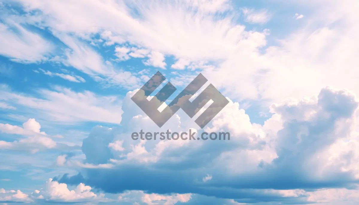 Picture of Bright Sunny Sky with Fluffy Clouds on a Clear Day