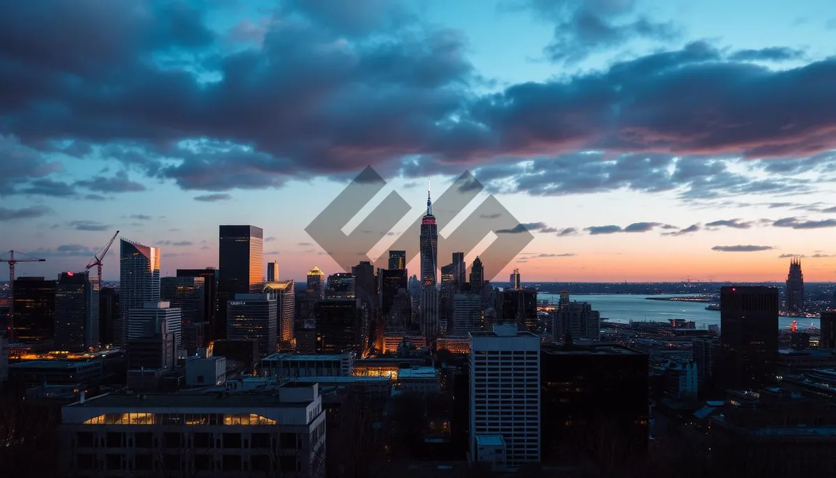 Picture of Modern skyline with skyscrapers reflecting in river at dusk