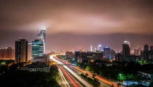 Modern Business Tower at Night overlooking City River.