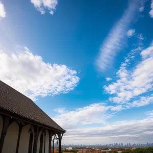 Summer Skyline: Majestic Clouds Over Idyllic Landscape