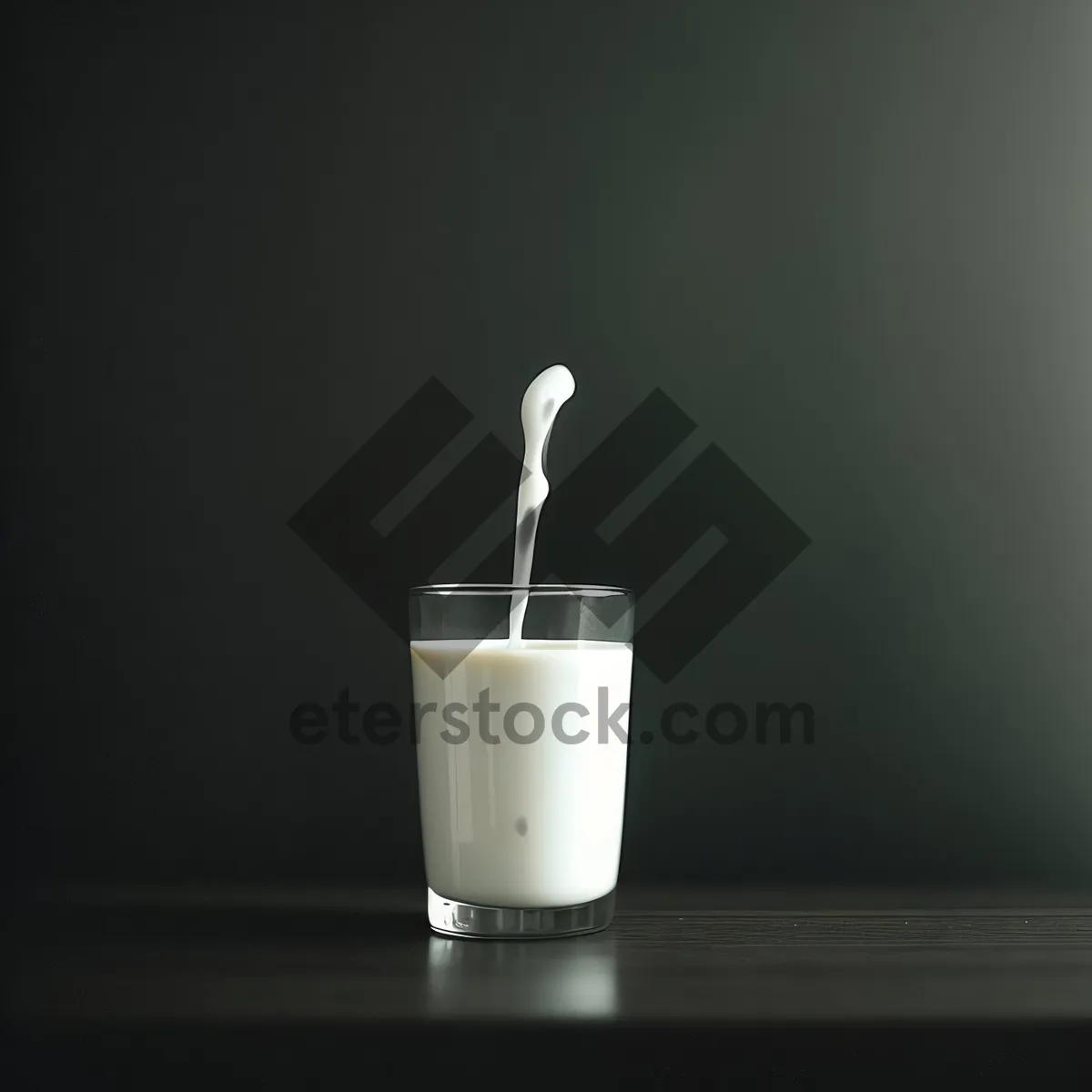 Picture of Hot morning coffee in a glass mug with spoon.