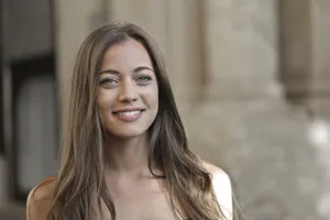 Smiling brunette model posing in fashion portrait