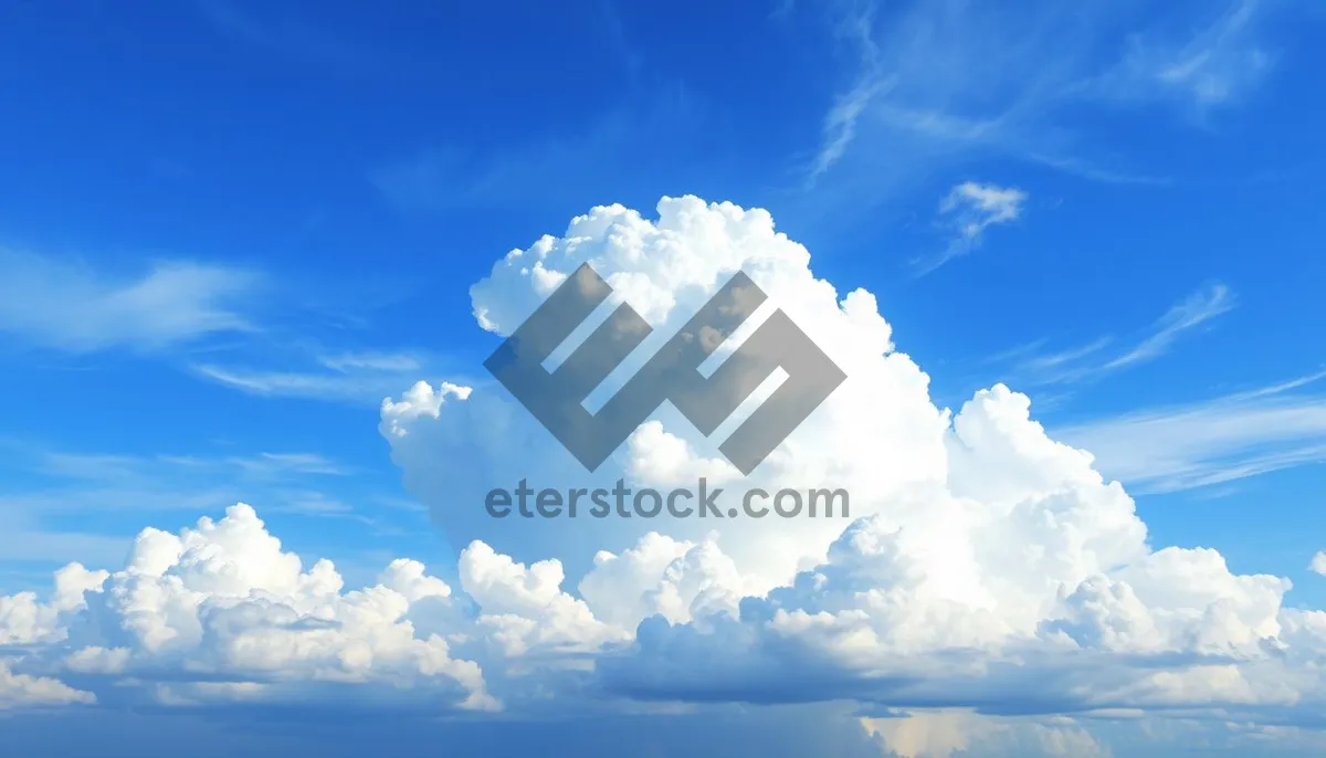 Picture of Bright sunny sky with fluffy white clouds.