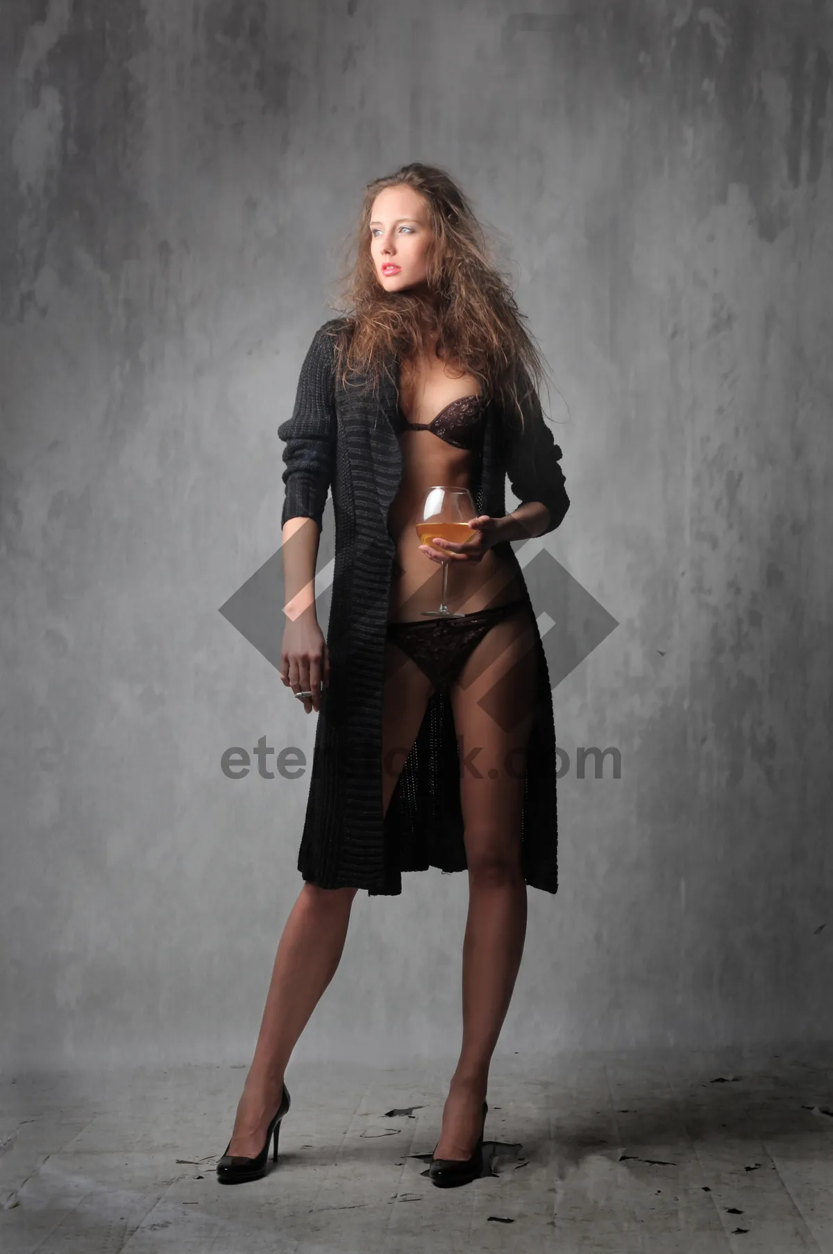 Picture of Sensual black dress fashion model posing elegantly