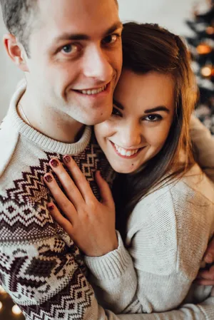 Happy couple embracing in romantic relationship outdoors.