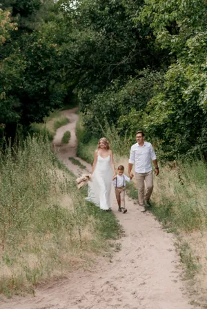 Happy couple walking in summer park