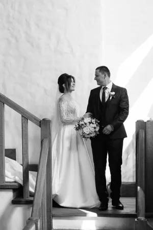 Happy Wedding Couple Celebrating Marriage with Bouquet