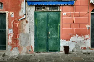 Ancient Wooden House with Stone Entrance and Vintage Brick