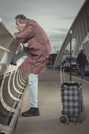 Man using device with shopping basket.