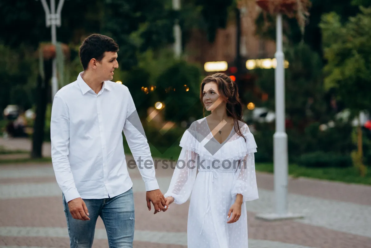 Picture of Happy couple smiling in the park at sunset