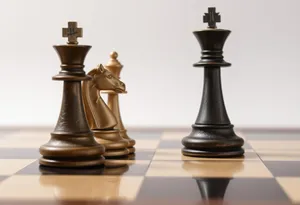 Strategic Chess Game on Wooden Board with Black Pieces