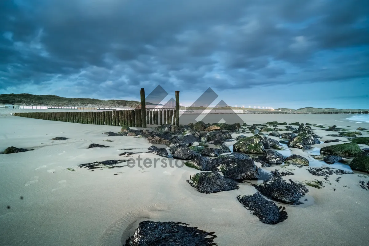 Picture of Sunset waves on a scenic coastal beach.