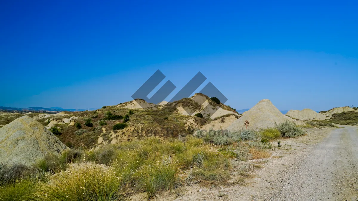 Picture of Majestic Mountain Range Ascent View Across Scenic Valley.