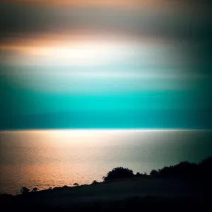 Spectacular Sunset Over Ocean and Mountains.