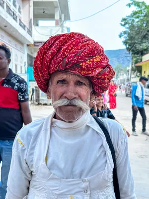 Senior male doctor with neck brace and mask