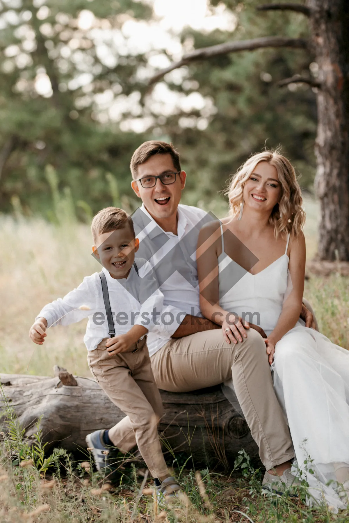 Picture of Happy couple in park smiling on wedding day