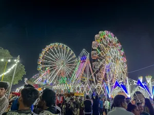 Festive Ferris Wheel Spinning in Night Sky