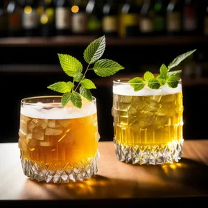 Refreshing Yellow Cocktail with Mint Garnish