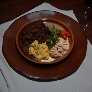 Healthy beef and vegetable bowl with rice and sauce.