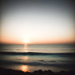 Sunset Horizon over Golden Ocean Waves