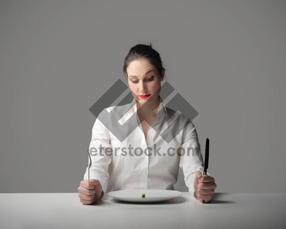 Picture of Happy male professional working on laptop in office.