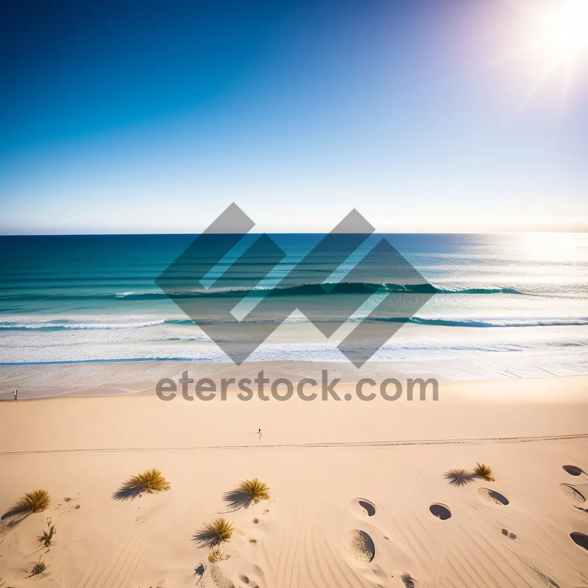 Picture of Sun-kissed coastal paradise: Tranquil waves caress sandy shorelines under a radiant sky.