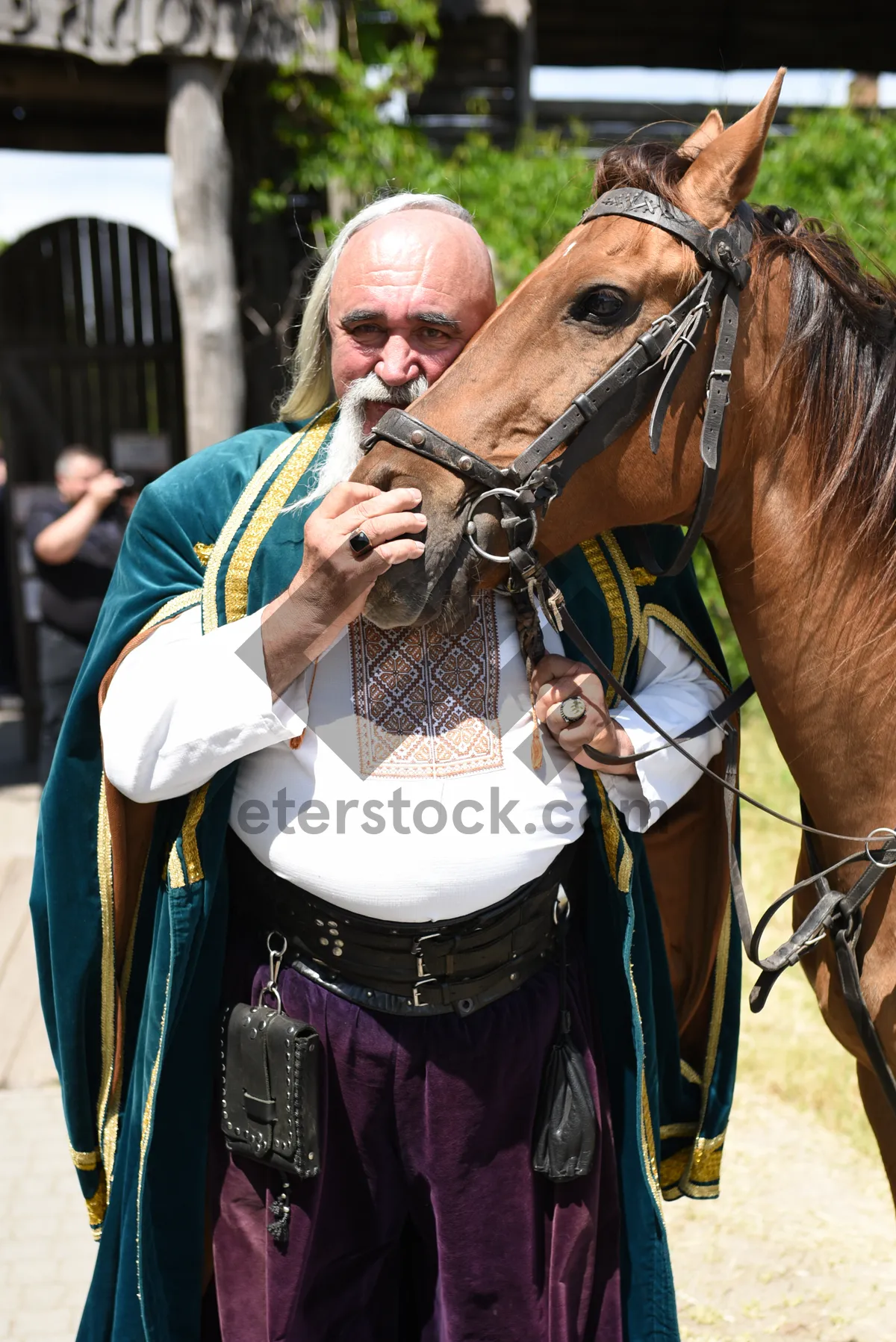 Picture of Musician playing flute with a horse listening attentively.