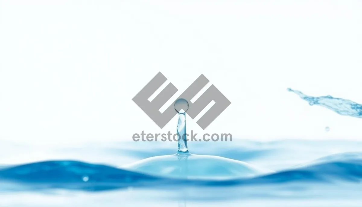 Picture of Glass water droplet with thumbtack reflection.