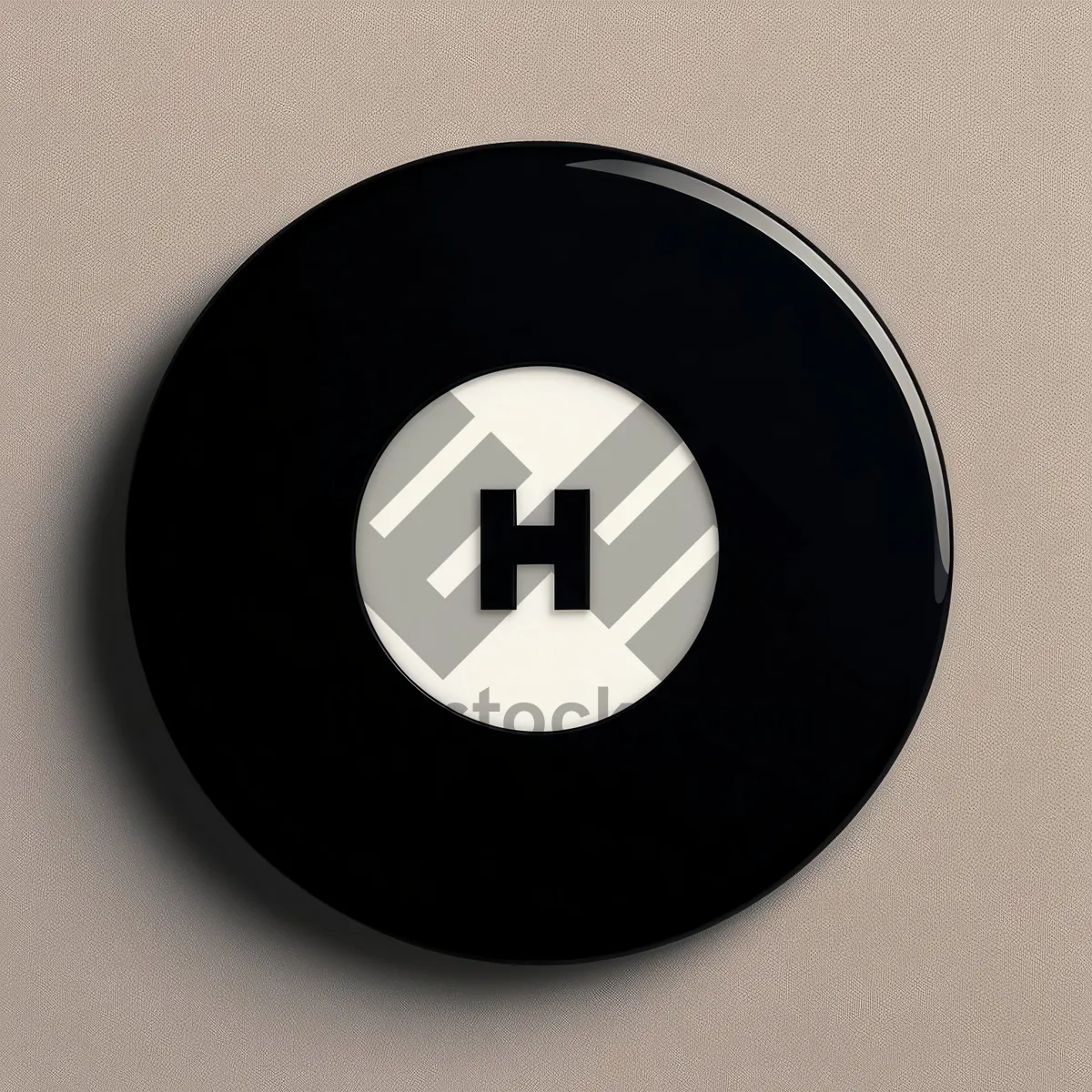 Picture of Shiny black button icon on round device.