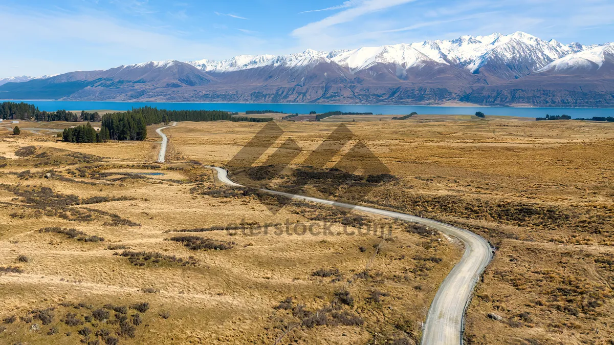 Picture of Distant mountain range under clear sky mile-high plateau landscape.