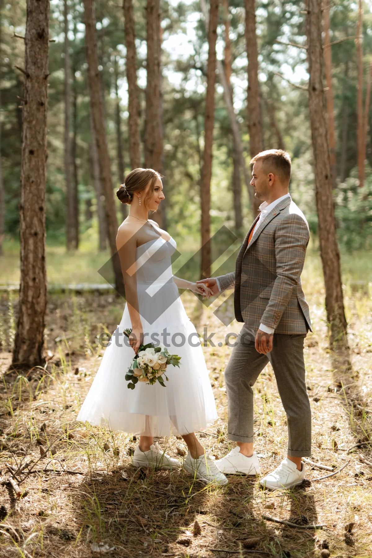 Picture of Happy couple celebrating love on wedding day outdoors