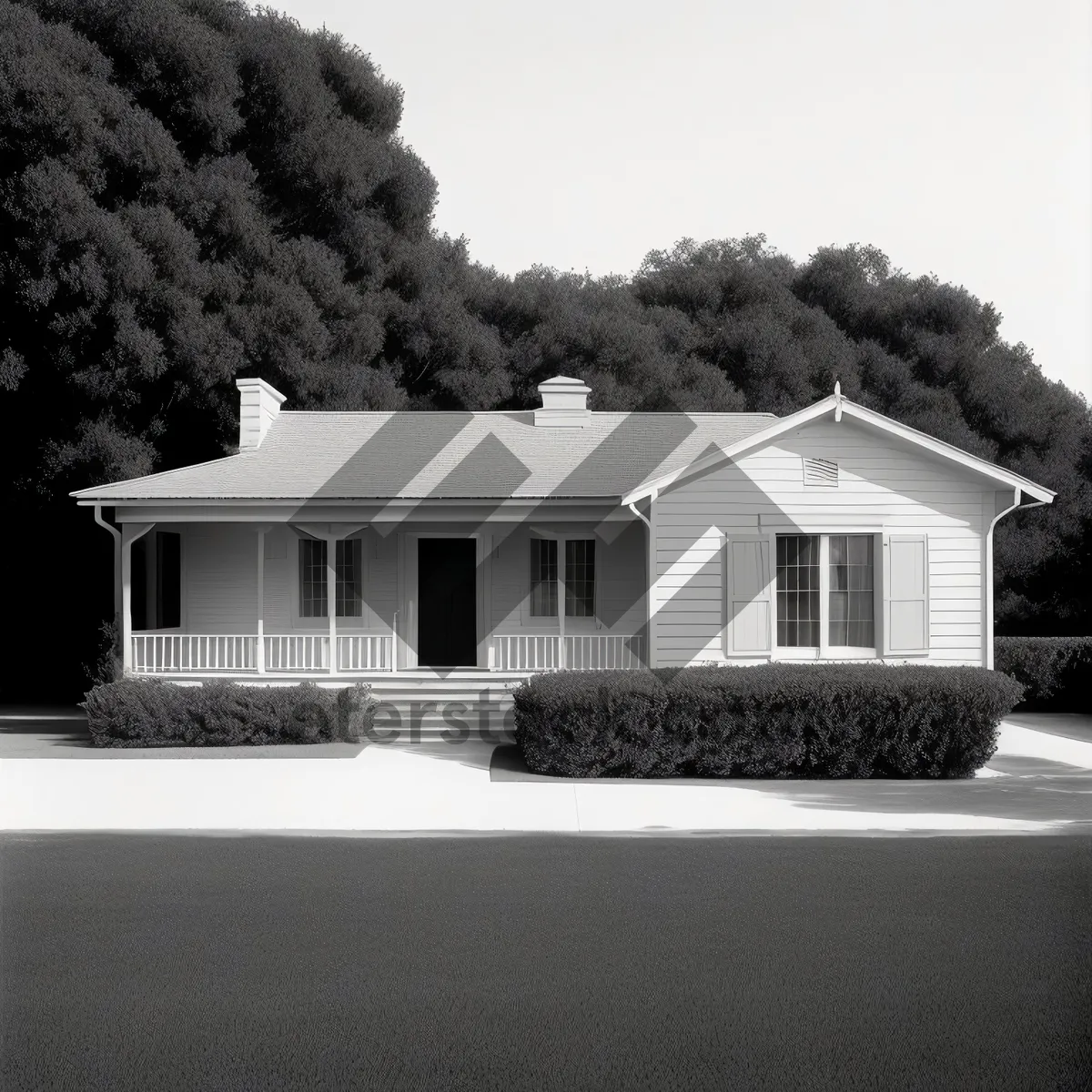 Picture of Modern suburban brick house with garage and driveway.