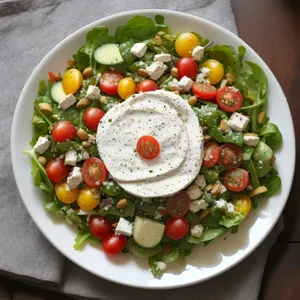 Fresh vegetable salad with berries and olives.