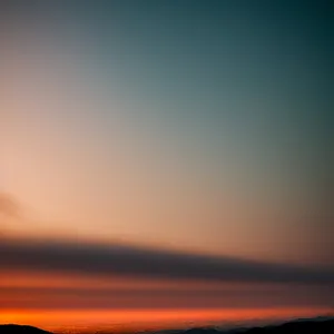 Golden Horizon: Sunset Over Desert Landscape