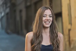 Attractive brunette model smiling for fashion shoot.