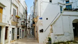 Ancient monastery in urban cityscape with old houses