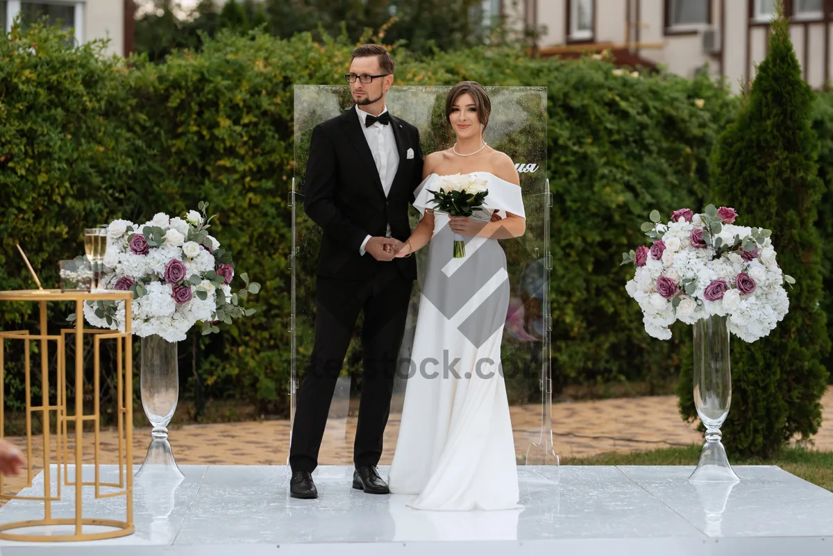 Picture of Happy Wedding Couple Outdoors Smiling and Celebrating Love