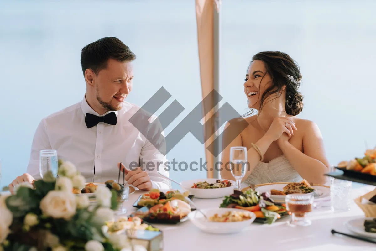 Picture of Happy man enjoying meal at restaurant table