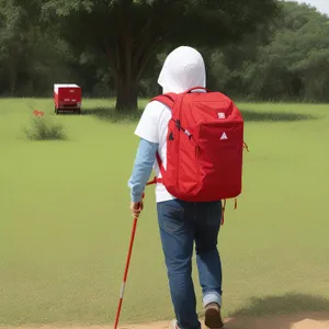 Active male golfer putting on green during competition.