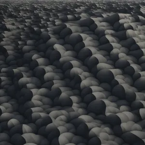 Beachfront tile roof over cobblestone and rock.