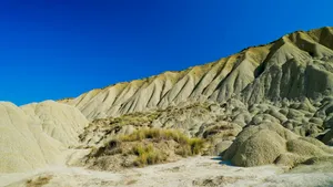 Protective Roof Over Desert Mountain Range Under Blue Sky