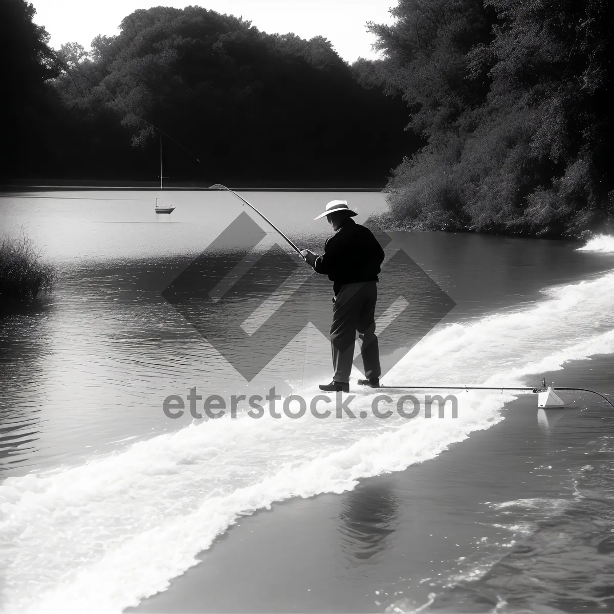 Picture of Sunset Angler with Fishing Rod on Beach