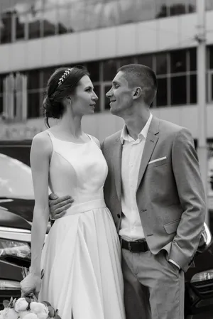 Happy wedding couple in love and smiling together outdoors