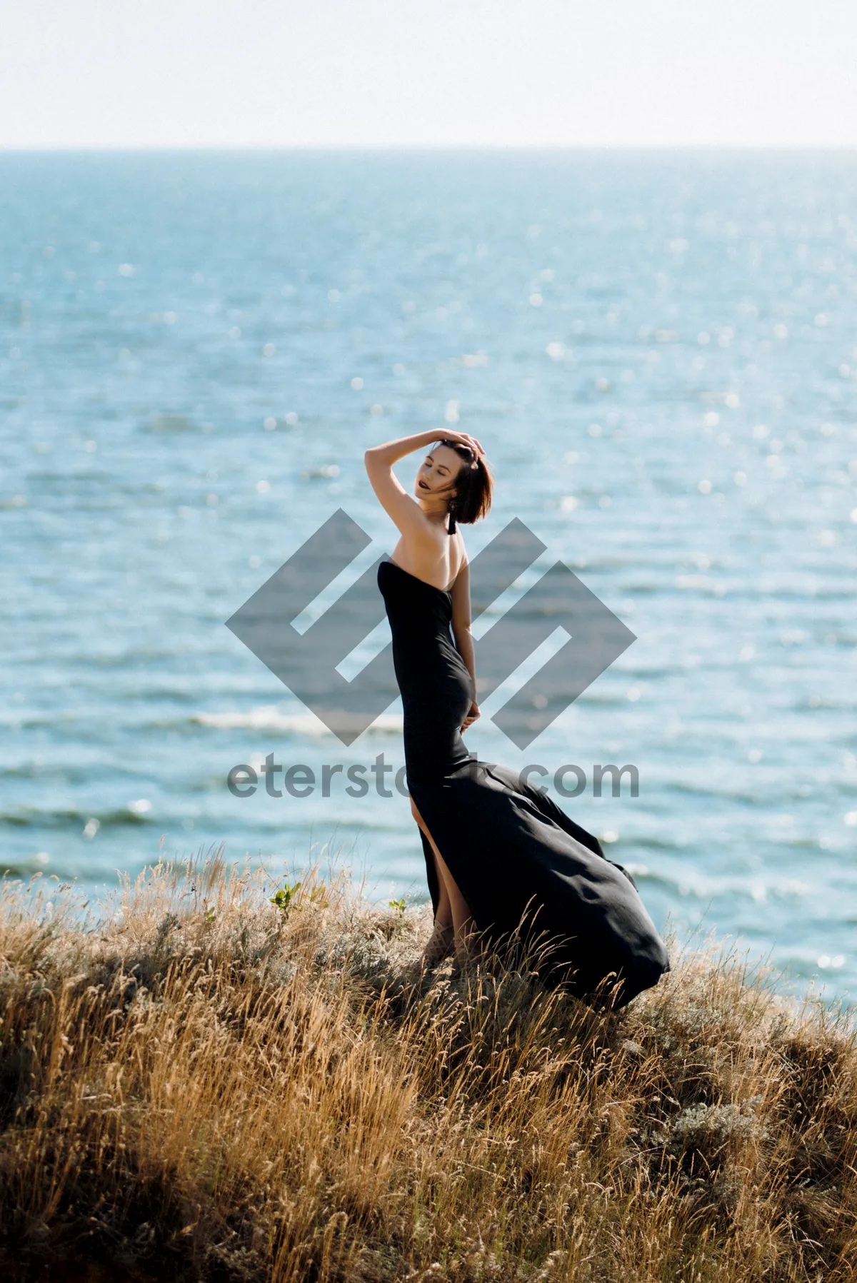 Picture of Attractive model enjoying the sun at the beach shore