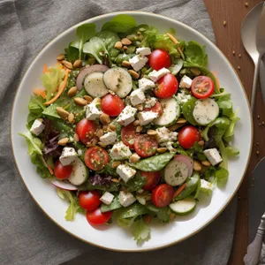 Fresh vegetable salad with savory sauce on plate