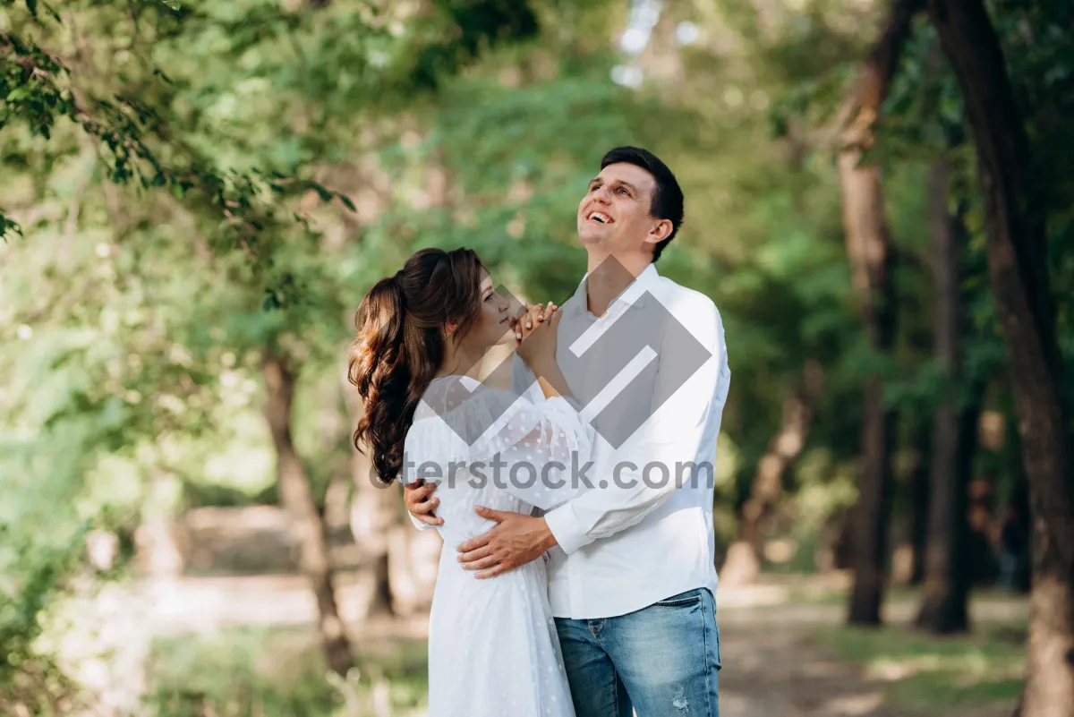 Picture of Happy couple in park smiling together outdoors.